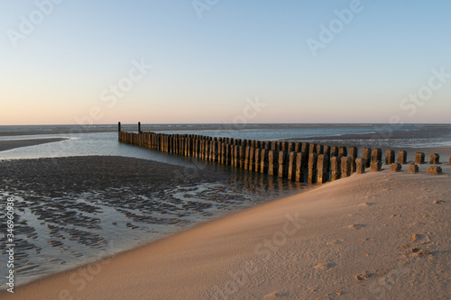 sunset at the beach  blue hour  breakwaters