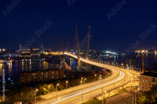 Golden bridge in Vladivostok at night. Night traffic. Golden Bridge in sunset, Vladivostok, Russia.