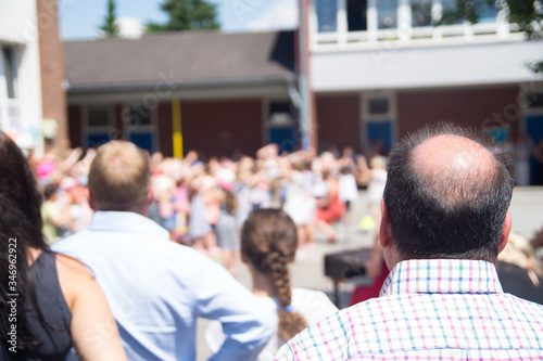 Dance performance of a primary school with spectators