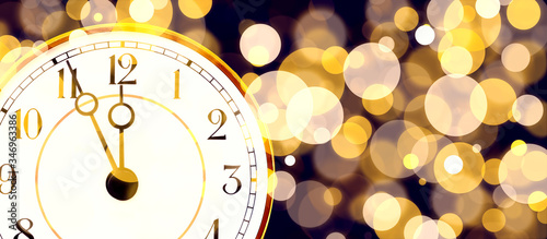 New year christmas banner with clock, bokeh.