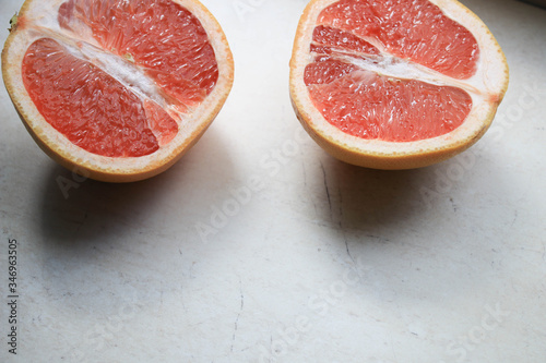 Sliced grapefruit on a light background