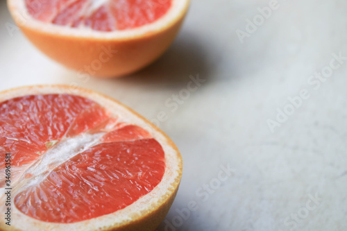 Sliced grapefruit on a light background