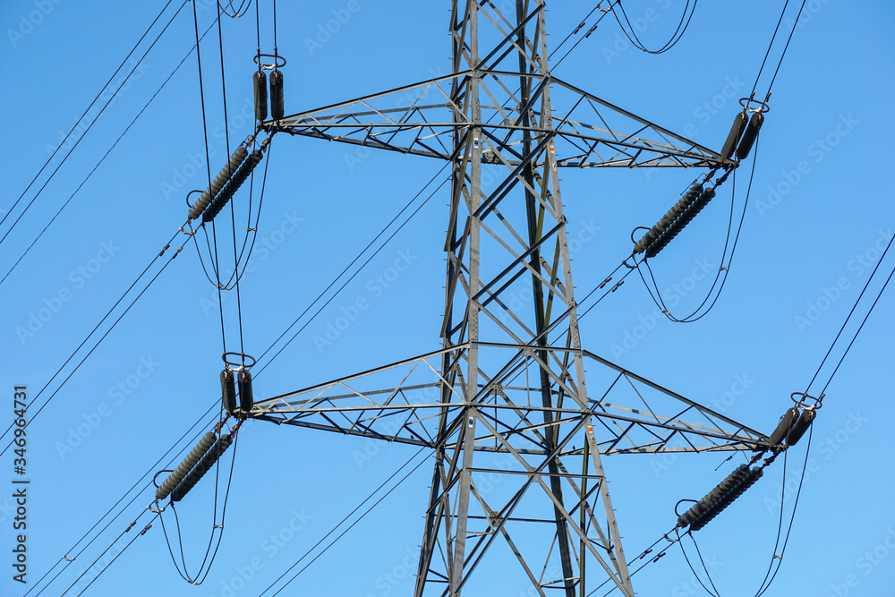 Electricity pylon with blue sky in the background