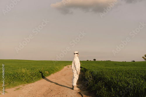 Wallpaper Mural Man wearing protective suit and mask in the countryside Torontodigital.ca