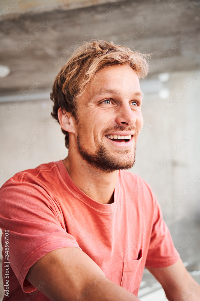 Portrait of laughing young man wearing red t-shirt Portrait of laughing young man wearing red t-shirt