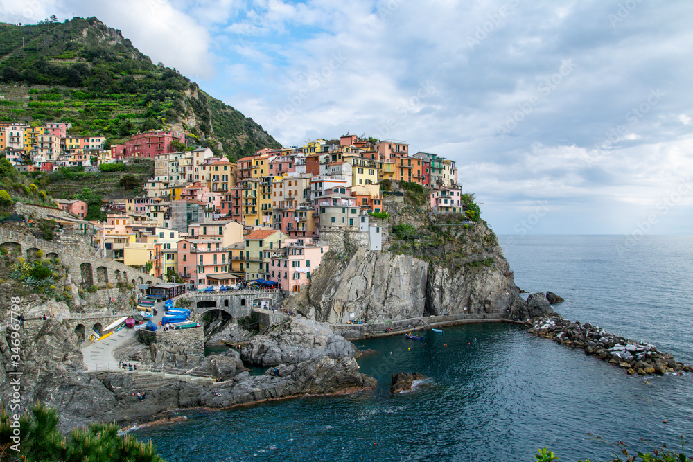 Beautiful colorful cityscape on the mountains over Mediterranean sea, Europe, Cinque Terre, traditional Italian architecture.