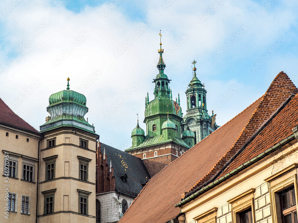 Beautiful architecture and rooftops of Wawel Castle with blue sky in background. Beautiful architecture and rooftops of Wawel Castle with blue sky in background.
