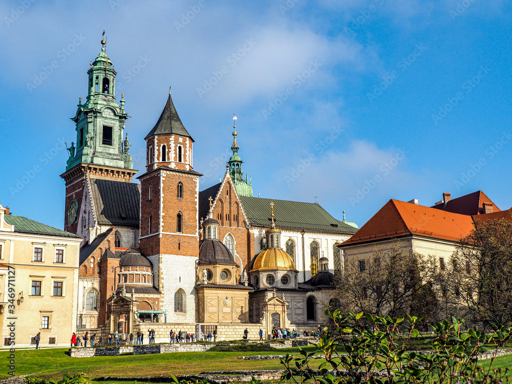 Beautiful architecture and  rooftops of Wawel Castle with blue sky in background.