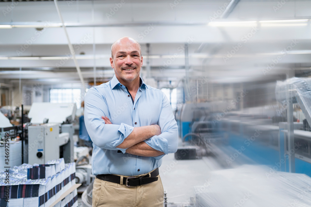 Portrait of a confident businessman in a factory Portrait of a confident businessman in a factory