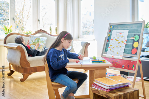 Children learning at home during school closure photo