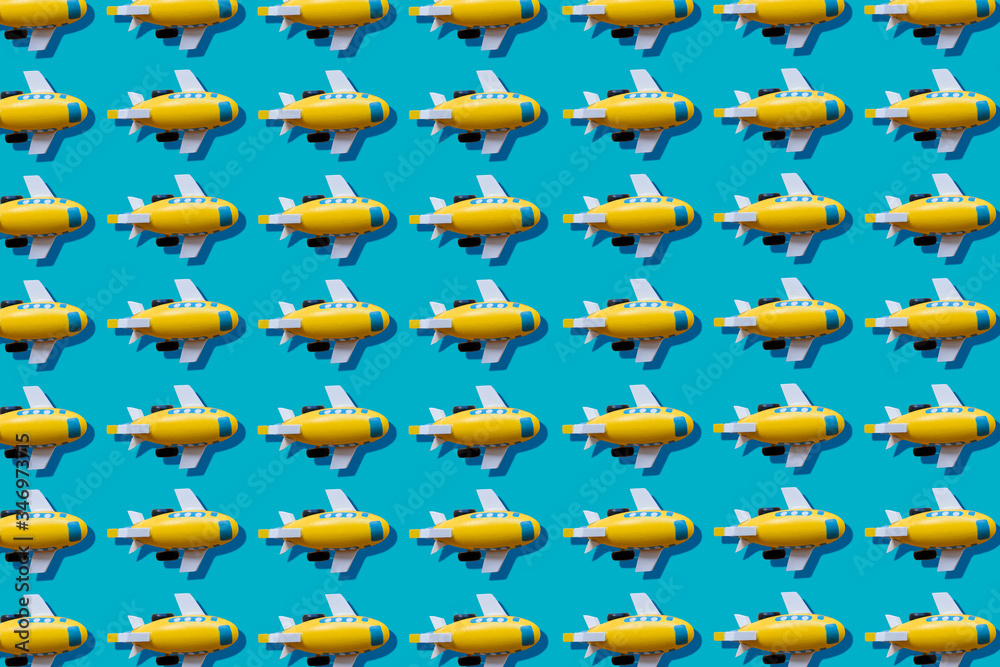Yellow planes in a row on blue background Yellow planes in a row on blue background