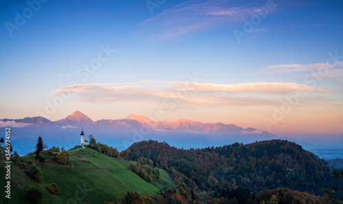 Slovenia, Church of St Primoz near Jamnik at sunset photo