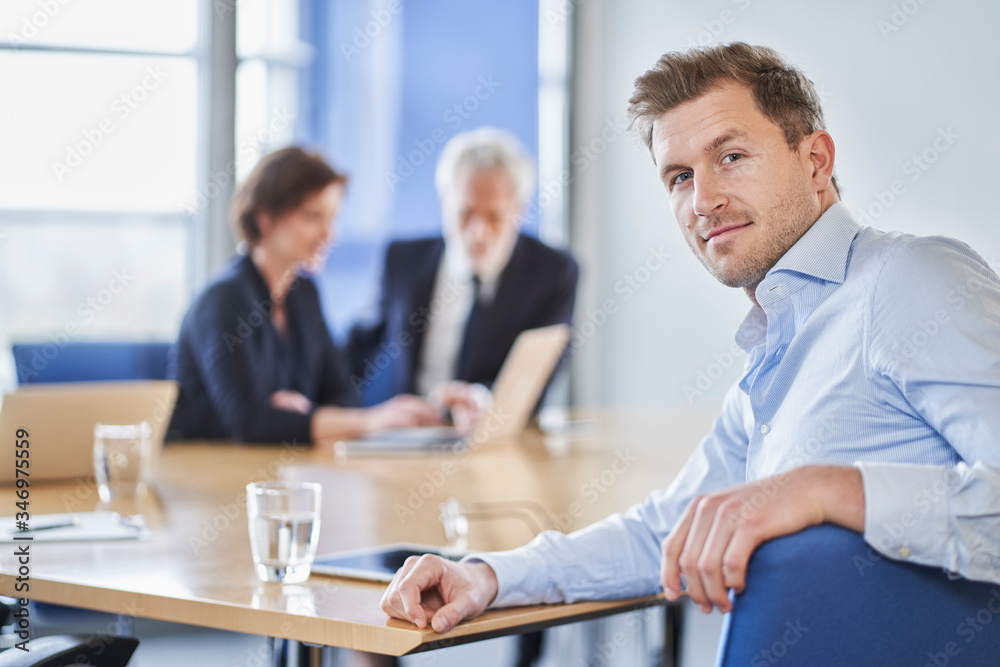 Portrait of confident businessman during a meeting in office Portrait of confident businessman during a meeting in office