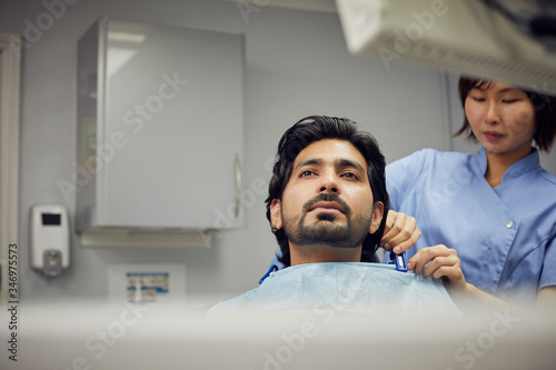 Medical secretary preparing dental treatment for patient