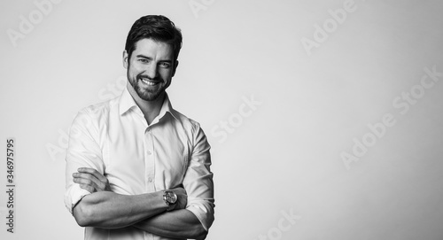 Portrait of confindent man, with arms crossed photo