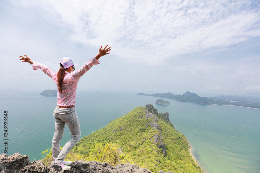 woman rising hands on mountain feel happy and freedom to achieve of hikking trip woman rising hands on mountain feel happy and freedom to achieve of hikking trip