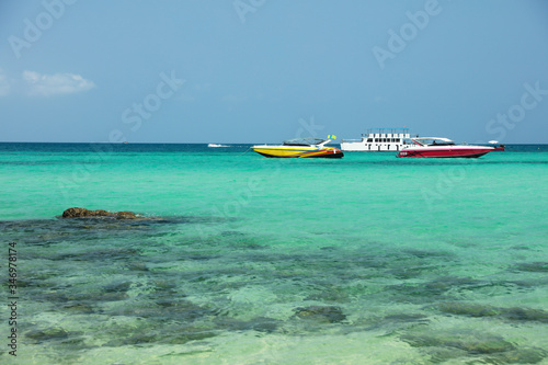 Fototapeta Naklejka Na Ścianę i Meble -   speedboat parking on blue sea standby support tourism 