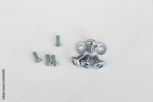 Metal screws, bolts, washers and nuts isolated on white background. 