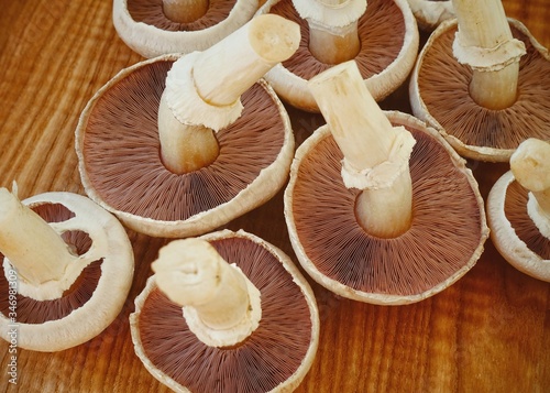 Fresh champignons on a wooden board