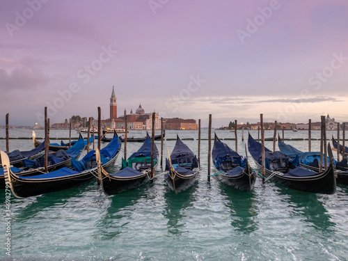Beautiful sunset from San Marco square, Venice, Italy, and the gondolas in the foreground and the church of San Giorgio Maggiore