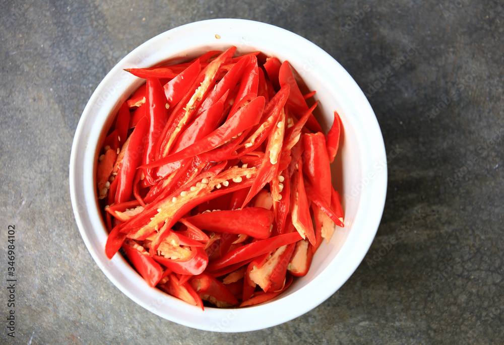 slice of red chili in cup ready for cooking slice of red chili in cup ready for cooking