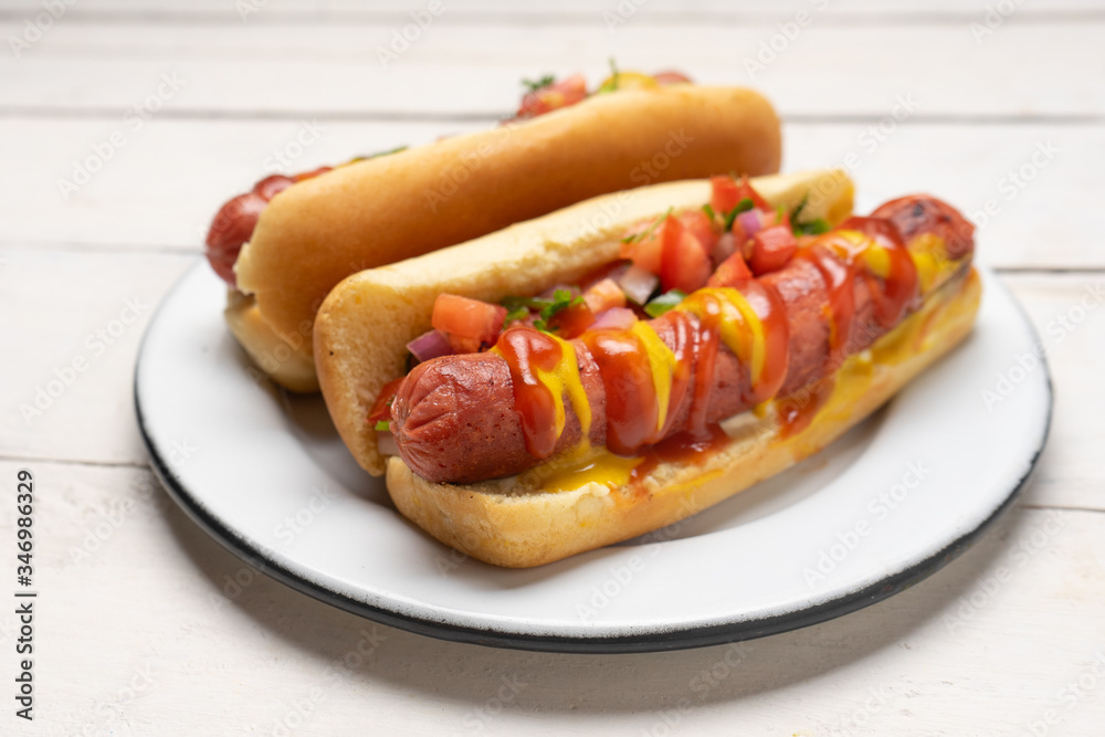 Hot dog with pico de gallo salad on white background Hot dog with pico de gallo salad on white background
