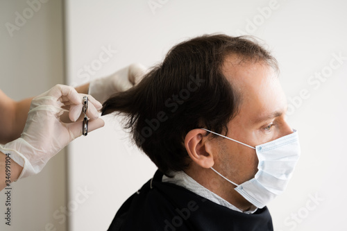 Man Cutting Short Hair At Salon