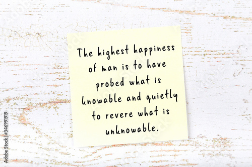 Yellow sticky note with handwritten motivational quote