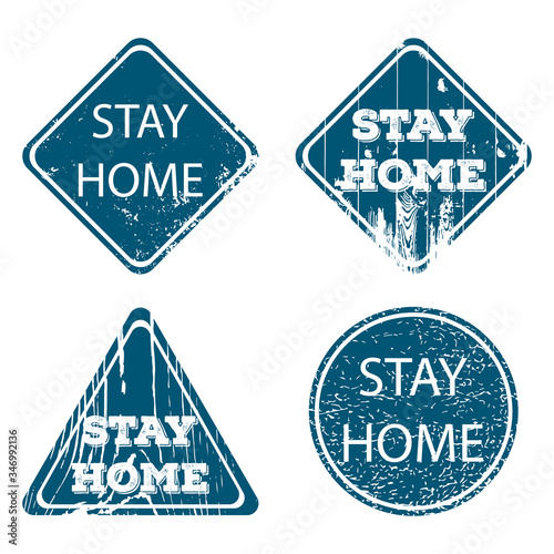 Stay home - road sign with grunge effect. Be safe during the coronavirus epidemic and observe quarantine. Four elements with different shapes and textures. Vector illustration.