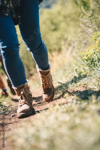 A close up of two hikers walking 