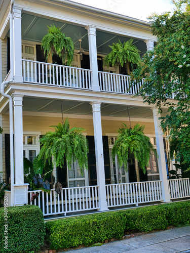 Hanging flower baskets on the porch of a Southern mansion. 