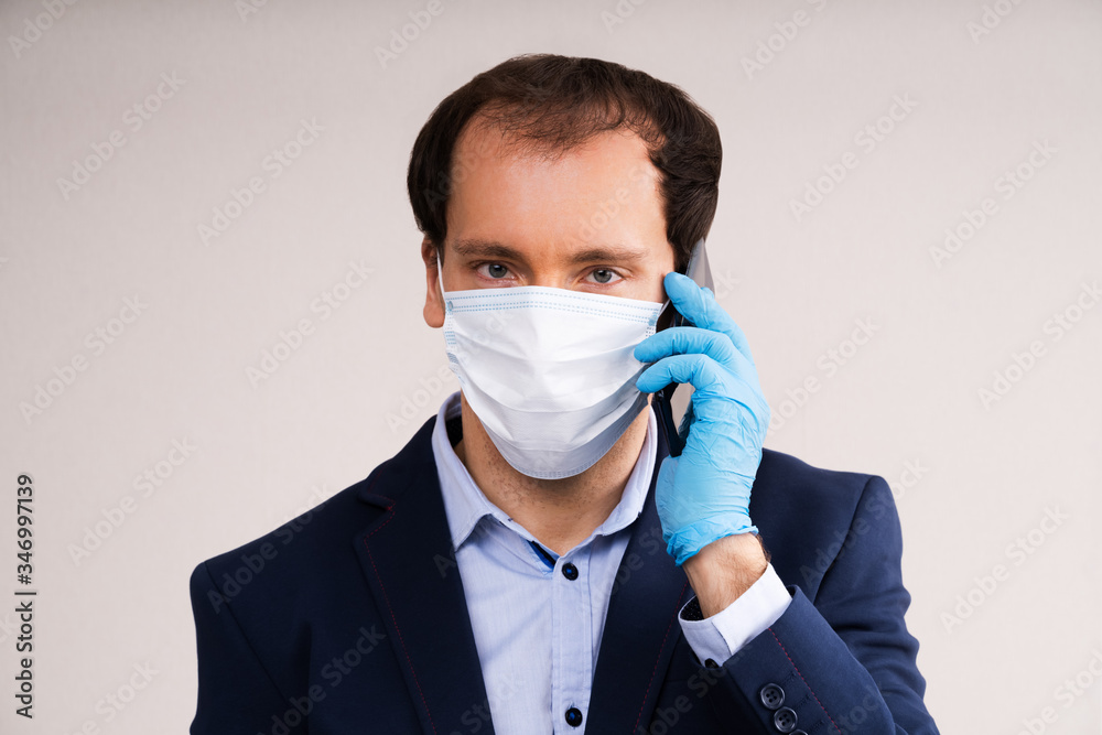 Man In Mask And Gloves Using Mobile Phone Man In Mask And Gloves Using Mobile Phone