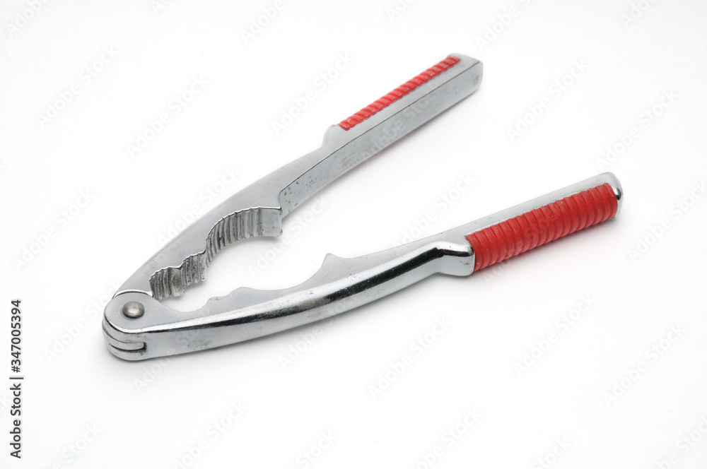 Tongs for nuts on a white background