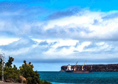 boat in the sea, water, island, ocean, sky, clouds, blue, Galapagos, Ecuador, travel, tourism, park, tropical