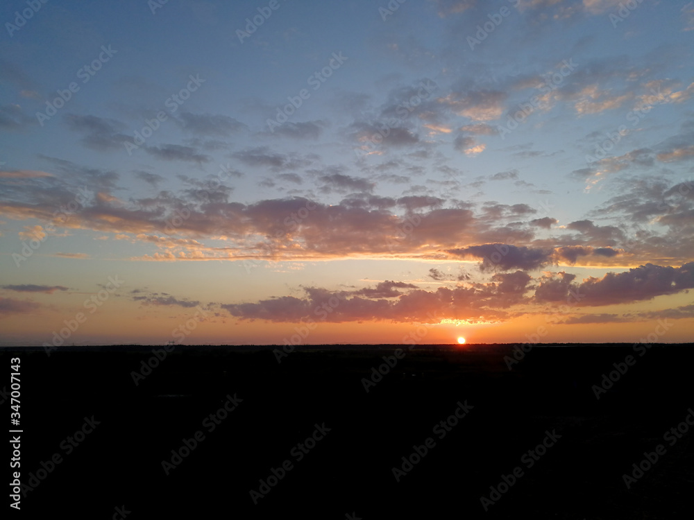 Natural summer sunset in rural area