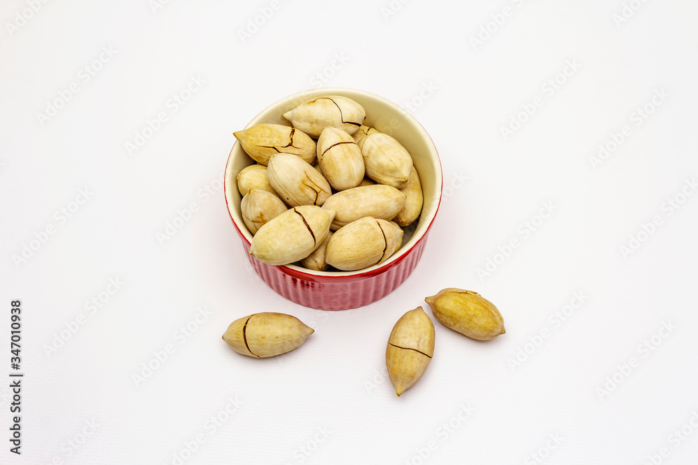 Ripe pecan isolated on white background
