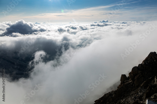 Clouds and fog over the Chamonix valley. View from the Cosmique refuge, Chamonix, France. Perfect moment in alpine highlands.