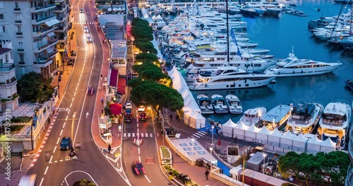 Monaco, Monte-Carlo 30.09.2017: Time-lapse of movement of boats in port, boat yacht show, event is over, the richest people from around the world, cityscape, tenders, mega yacht, night lights