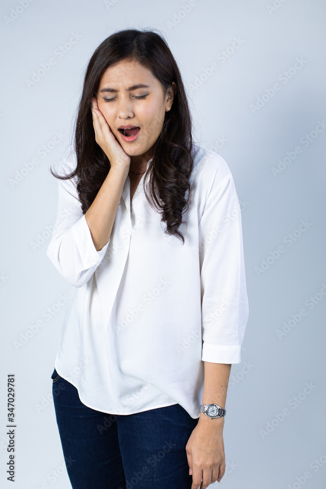Asian women suffer from severe toothache. Teeth decay, teeth sensitivity and dental clinic Asian women suffer from severe toothache. Teeth decay, teeth sensitivity and dental clinic