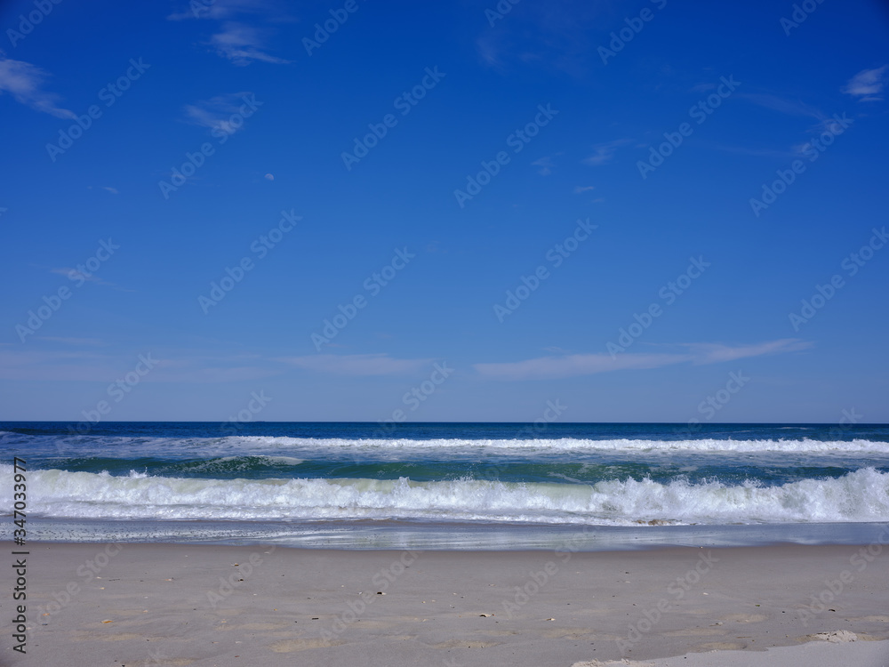 Nearly empty beaches on Island Beach state park in New Jersey the day the beaches opened during the covid-19 pandemic