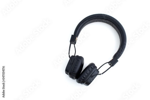 Black vintage wireless headphone isolated on white background.