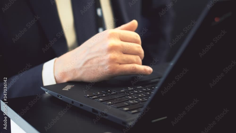 Male Fingers Touch Laptop Keyboard Close-Up. 2 Version Male Fingers Touch Laptop Keyboard Close-Up. 2 Version