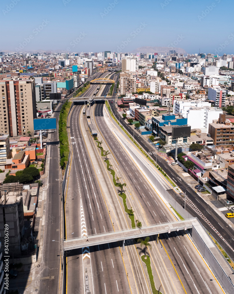 Fototapeta premium Aerial drone view of the empty highway of Lima city at lockdown at coronavirus pandemic in 2020, in Peru.