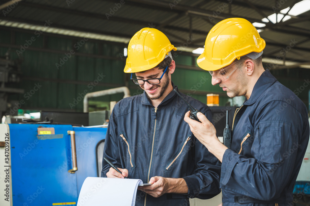 Industrial workers are working on projects in large industrial plants with many devices. Industrial workers are working on projects in large industrial plants with many devices.