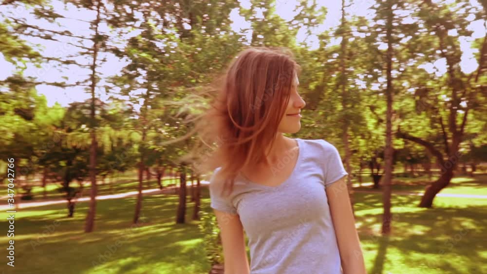 happy summer lifestyle slow motion caucasian woman with red hair enjoy freedom and outdoors