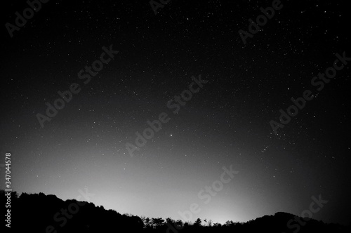 Canvas Print Silhouette Mountains Against Sky With Star Field