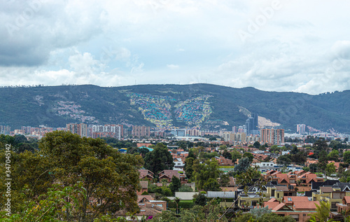 North Bogota city landscape with a famous view of a butterfly "mariposa" neighborhood. A multicolor painted suburbs at the north oriental city mountains. 