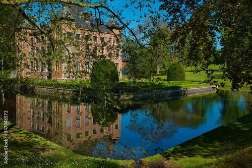 Mesmerizing scene of a pond with the Coloma castle in the background in Belgium photo