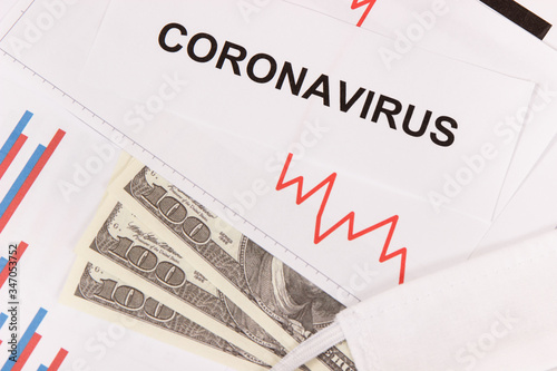 Currencies dollar with downward graphs representing financial crisis caused by coronavirus. Covid-19