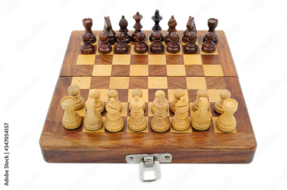 A chessboard with a full set of chess pieces (focus on the white pieces) A chessboard with a full set of chess pieces (focus on the white pieces)